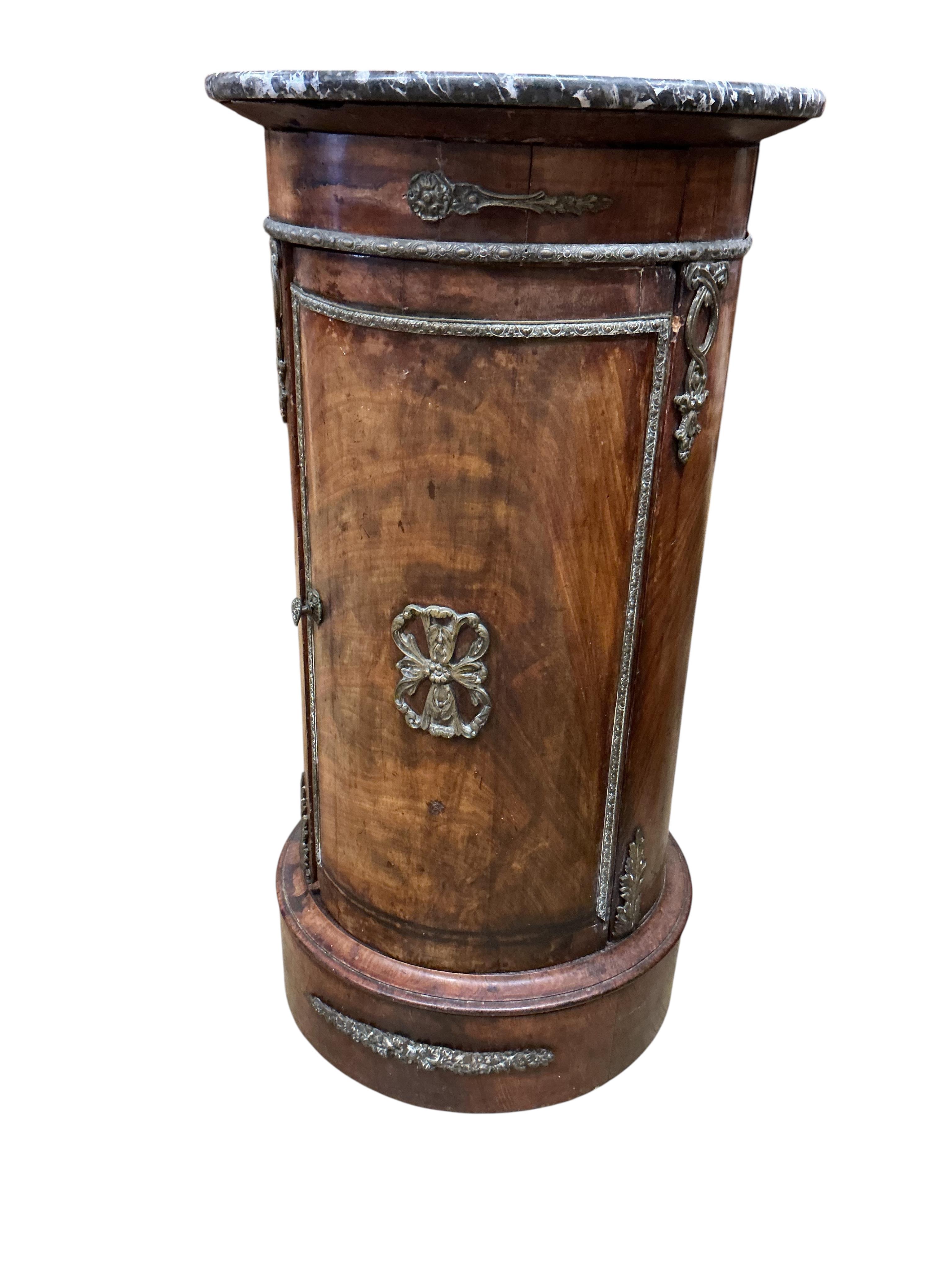 A 19th century French ormolu mounted mahogany cylindrical pot cupboard, with dished grey marble top, diameter 40cm, height 75cm